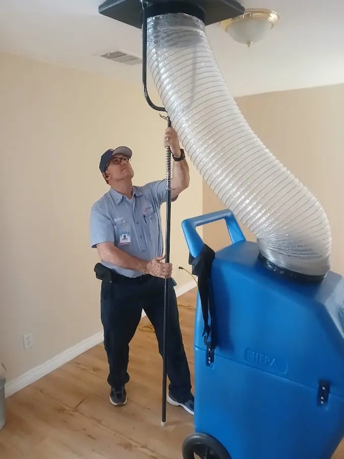 Furnace Tune-Up technician using HEPA equipment in Charlottesville